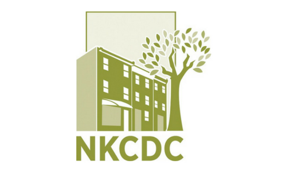 New Kensington Community Development Corporation logo in green with the letters NKCDC under the outline of a building with a tree next to it