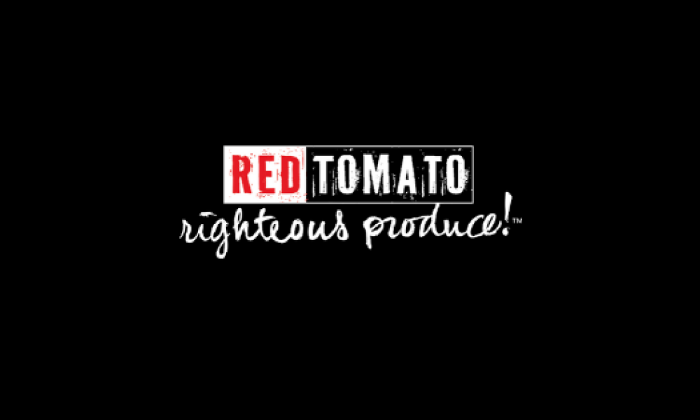 Red Tomato logo with red and white text in front of a black background