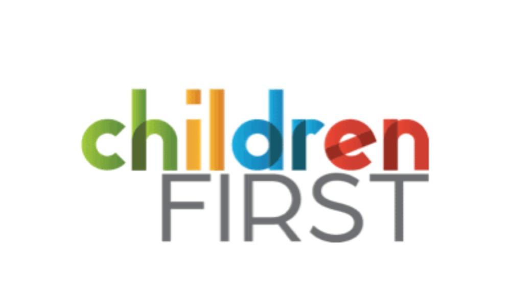 Children First logo which features the world children in the colors red, yellow, blue, and green