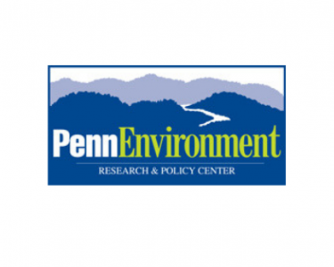 PennEnvironment logo with Penn in white font and Environment in green font in front of blue mountains